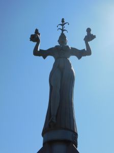 The rather buxom Imperia holds caricatures of Baldasarre Cossa (a pope at the time of the council) and King Sigismund